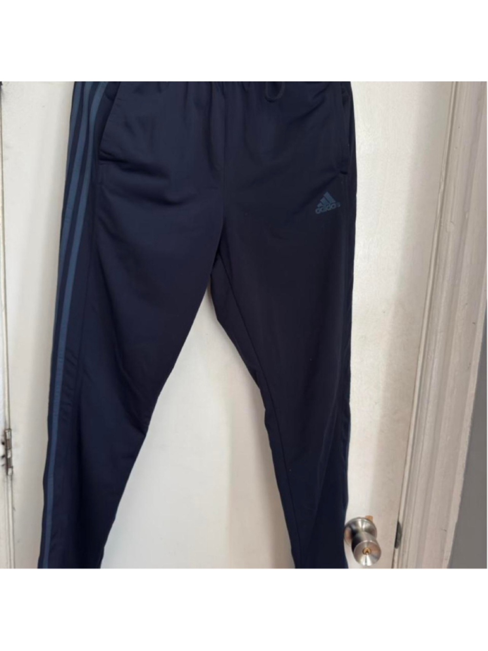 Navy blue Adidas track pants with three stripes #athletic #sporty